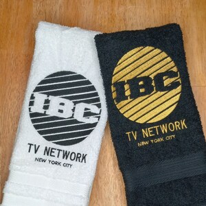 IBC TV Network Logo Yule Love It embroidered hand towels for sale by Beyond Embroidery Art. Scrooged movie Christmas classic.