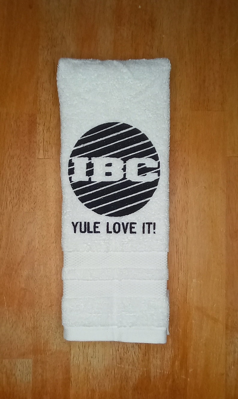 IBC TV Network Logo Yule Love It embroidered hand towels for sale by Beyond Embroidery Art. Scrooged movie Christmas classic.