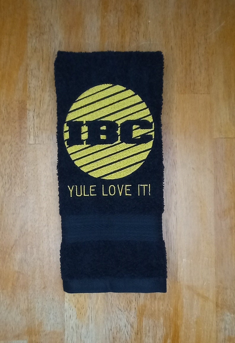 IBC TV Network Logo Yule Love It embroidered hand towels for sale by Beyond Embroidery Art. Scrooged movie Christmas classic.