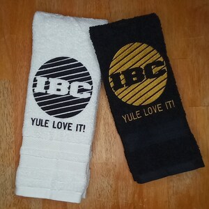 IBC TV Network Logo Yule Love It embroidered hand towels for sale by Beyond Embroidery Art. Scrooged movie Christmas classic.