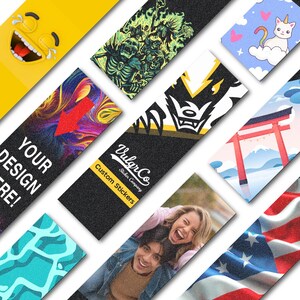 May include: A collection of various stickers with diverse designs. Includes a yellow laughing emoji, a green and black skeleton graphic, a cat riding a cloud, a red arrow, a logo with text "Your Design Here!", and a photo of a couple.