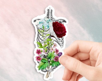 Könnte beinhalten: Ein Aufkleber mit einem menschlichen Brustkorb, aus dem eine rote Rose und verschiedene Blumen wachsen.