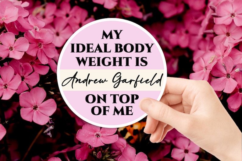 May include: A pink and white round sticker with the text "My ideal body weight is Andrew Garfield on top of me".