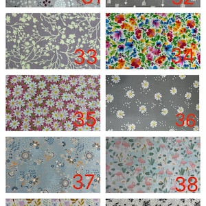 May include: A collection of ten fabric swatches featuring various patterns including floral prints, white daisies on grey, pink flamingos, white arrows on grey, and botanical designs, each labelled with a red number from 31 to 40 for identification.