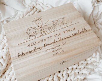 May include: A wooden keepsake box with a light wood finish. The box is engraved with the text "Welcome to the world Tobias Ray David Harris-Corbett" and the date "12th August 2023". The box also includes the time of birth "10:04AM" and the baby's weight "7lbs 9oz". The box is decorated with a small illustration of a lion, giraffe, elephant, and rhinoceros.