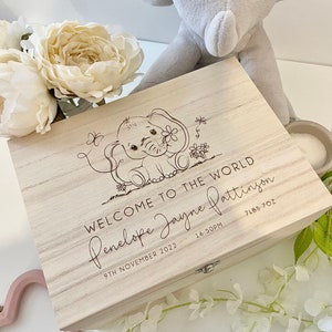 May include: A wooden keepsake box with an engraved elephant design. The box is personalised with the text "Welcome to the world Penelope Jayne Pattinson", "9th November 2022", "16:50PM", and "7lbs 7oz".