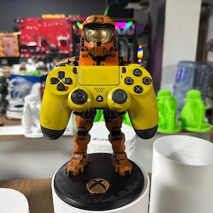 May include: A set of three ceramic mugs with a speckled, matte finish. The mugs are in shades of cream, light brown, and dark brown. Each mug has a simple, minimalist design, perfect for coffee or tea.