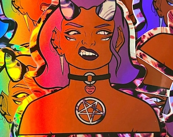May include: Holographic sticker featuring a stylized illustration of a demon with multiple eyes, horns, and fangs. The demon has purple hair and is wearing a black choker with a heart pendant that says "Megata 666". A pentagram is on the demon's chest.