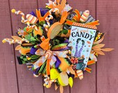 Large colorful candy themed Halloween wreath, orange and yellow, whimsical and festive, perfect for Halloween lover!