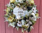 Fall wreath for front door, Sage green and cream fall wreath, magnolia blooms, sunflowers and house shaped sign. Welcoming porch decoration
