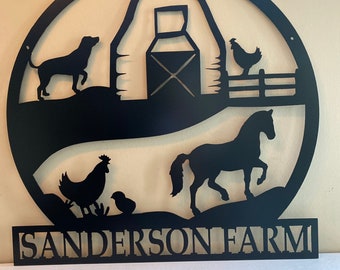 May include: Black metal silhouette of a farm scene with a barn, horse, dog, and chickens. The text "SANDERSON FARM" is below the scene.