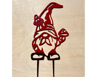 May include: Red metal gnome garden stake with two mushrooms. The gnome is standing with its arms crossed and has a pointed hat.