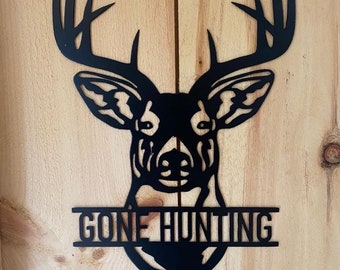 May include: Black metal deer head silhouette with antlers and the text "Gone Hunting" underneath.