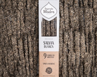 May include: A package of 9 thick incense sticks labeled "Sagrada Madre" with the text "Sahumerio de Salvia Blanca" and "Linea Hierbas". The package is white with brown text and a green circle with the text "100% Natural".
