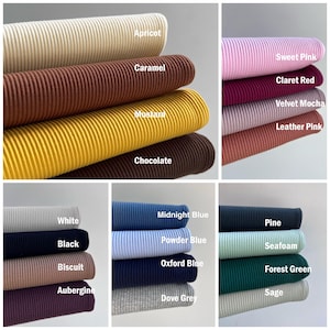 May include: A collage of fabric swatches in various colors, including apricot, caramel, mustard, chocolate, sweet pink, claret red, velvet mocha, leather pink, white, black, biscuit, aubergine, midnight blue, powder blue, oxford blue, dove grey, pine, seafoam, forest green, and sage.