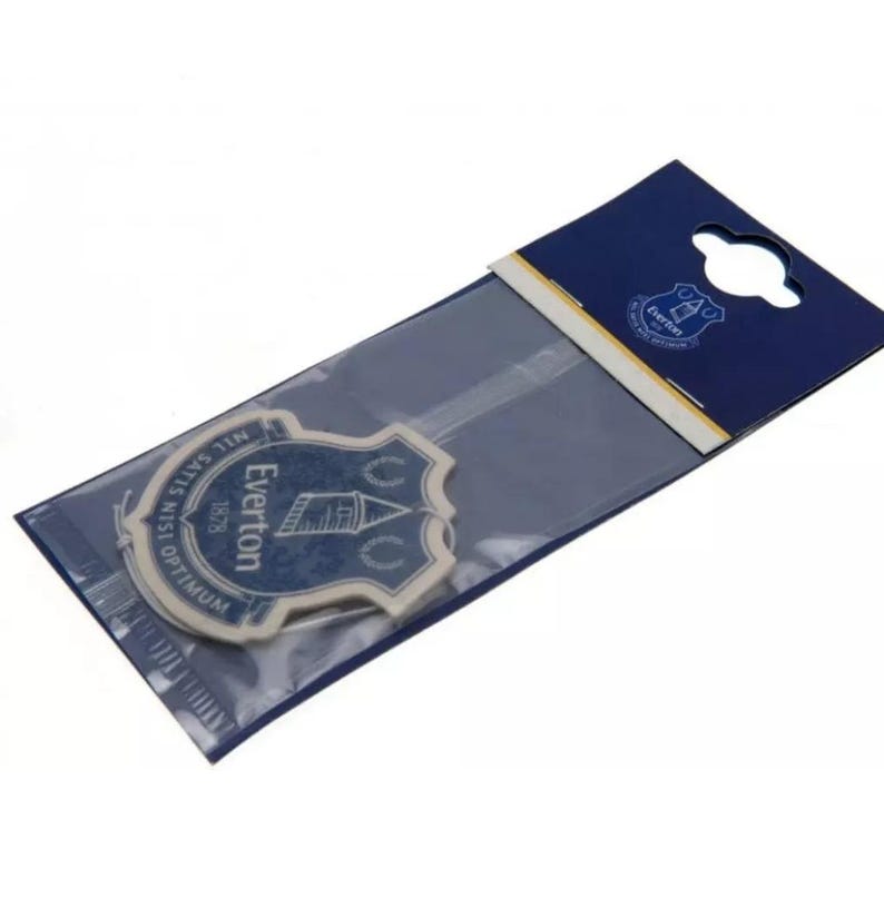May include: A blue and white car air freshener with the Everton Football Club crest and the text "NISI OPTIMUM NISI SATIS TEN 1878 EVERTON".