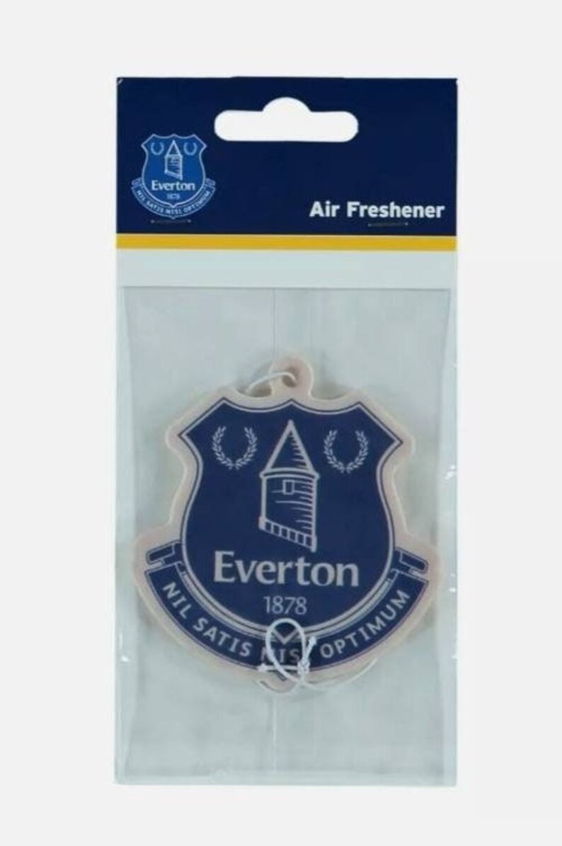 May include: A white car air freshener with a blue and white Everton Football Club crest. The crest features a tower, two wreaths, and the text "Everton 1878 Nil Satis Nisi Optimum".