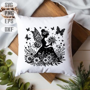 May include: Black and white silhouette of a fairy with wings sitting in a field of flowers. The fairy is holding a bouquet of flowers.