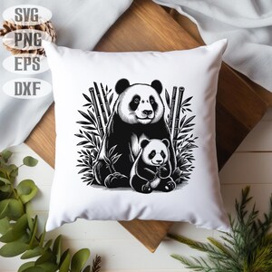 May include: White square cushion with a black and white illustration of a panda and a baby panda surrounded by bamboo. The cushion has a clean, modern design, suitable for home decor.