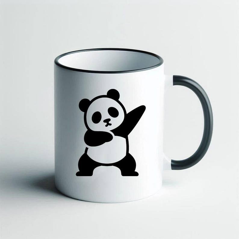 May include: White ceramic mug with a black rim, handle, and a black and white panda bear graphic. The panda is in a dabbing pose. The mug is a standard size for tea or coffee.