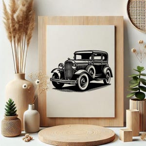 May include: Black and white illustration of a vintage car. The classic vehicle is depicted in a detailed line art style, showcasing its front grill, headlights, and wheels. The artwork is framed in a light wood frame, adding a touch of rustic charm.