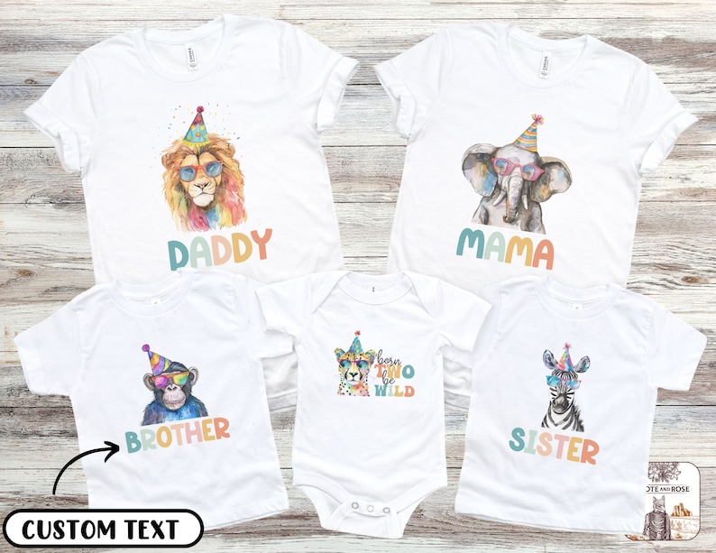 May include: White t-shirts with colorful animal graphics, including a lion, elephant, monkey, cheetah, and zebra, each wearing party hats and sunglasses. Text on the shirts reads "DADDY", "MAMA", "BROTHER", "born TWO be WILD", and "SISTER".