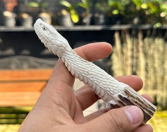 Antler carving - carved snake for knife handles.