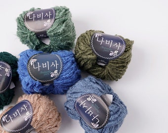 May include: Six skeins of textured yarn in shades of green, blue, and beige. Each skein features a dark blue paper label with the Korean text "나비사" and the English text "Butterfly yarn" printed in white, along with a small butterfly graphic.