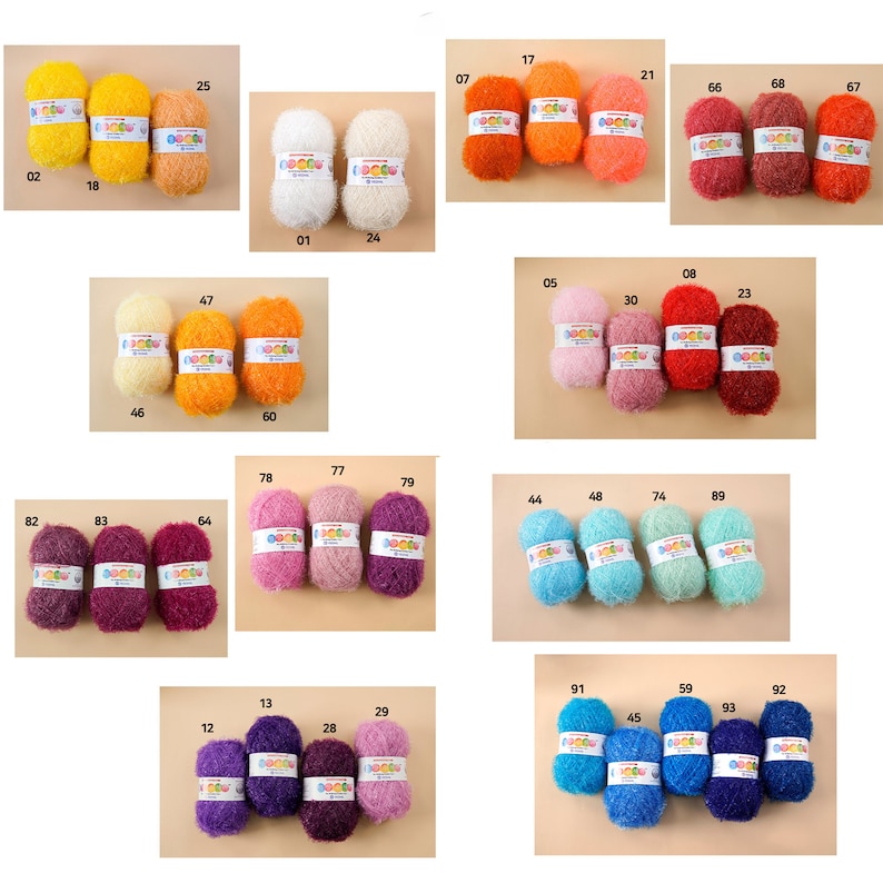May include: Assortment of colorful yarn balls in various shades of pink, purple, blue, green, orange, yellow, and red. The yarn balls are arranged in rows on a beige background. Each ball has a number printed on it.