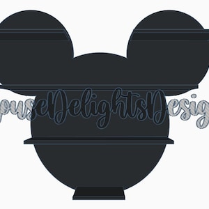 May include: Black silhouette of Mickey Mouse head with three shelves. The shelves are attached to the ears and the head of the silhouette. The text "Mouse Delights Designs" is visible in the lower left corner of the image.