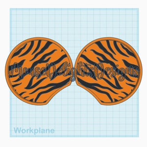May include: A pair of orange and black tiger print mouse ears. The ears are made of felt and have a black outline.
