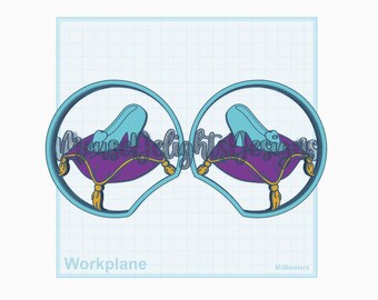 May include: A digital design featuring two teal-coloured circles with a Cinderella slipper on a purple cushion with gold tassels. The text "Moonlight Designs" is visible. The word "Workplane" is at the bottom.