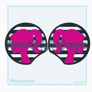 May include: Two pink silhouette designs of a woman's profile with a ponytail, set within a black and white striped circle. The text "Impulse Designs" is overlaid on the design. The background is a grid with the words "Workplane" and "Millimeters".
