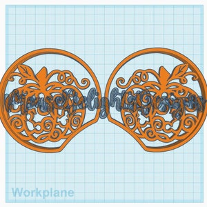 May include: Two orange pumpkin-shaped ornaments with intricate cut-out designs. The ornaments are connected together and feature a swirling vine pattern with a pumpkin in the center.