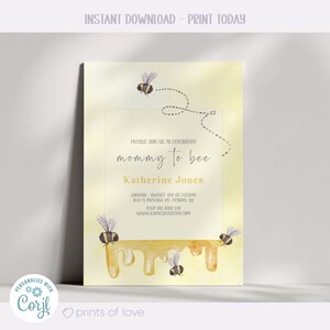 May include: A yellow and white baby shower invitation with a bee theme. The invitation says "Please join us to celebrate mommy to bee Katherine Jones" and includes the date, time, and location of the event. RSVP by July 5th. www.konesregistry.com