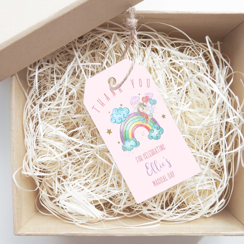 May include: Pink thank you tag with a unicorn riding a rainbow, clouds, and stars. The text reads "Thank You for celebrating Ellie's Magical Day."