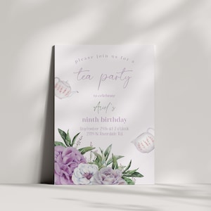 May include: A white tea party invitation with purple flowers and a teapot. The invitation says "Please join us for a tea party to celebrate Avel's ninth birthday. September 24th at 2 o'clock 21114 N Riverdale Rd."