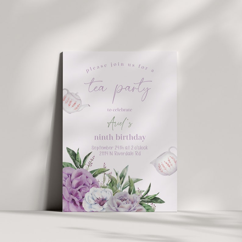 May include: A white tea party invitation with purple flowers and a teapot. The invitation says "Please join us for a tea party to celebrate Avel's ninth birthday. September 24th at 2 o'clock 21114 N Riverdale Rd."