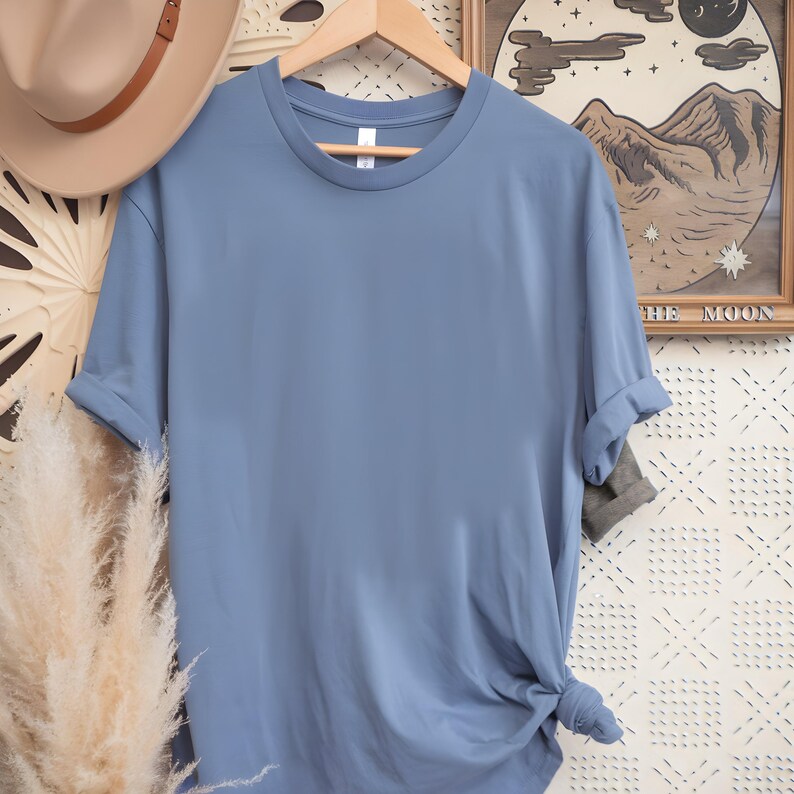 May include: A plain, light blue t-shirt with short sleeves and a crew neck.