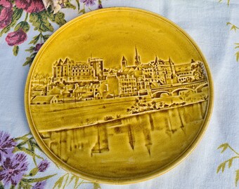 An old barbotine plate from Choisy le roi H.Boulenger HB et Cie town and castle of PAU France