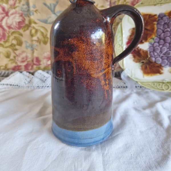 Old two-tone stoneware bottle, handcrafted, signed with flip top cap in porcelain and metal