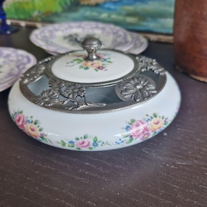 Antique round jewelry box or candy box in French Limoges porcelain and French Chanill pewter tin decorated with roses and flowers
