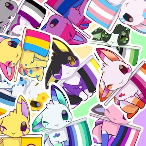 May include: A collection of colorful stickers featuring cartoon rabbits holding flags representing various LGBTQ+ identities. The rabbits have different fur colors, including pink, yellow, and purple. The flags display various pride flag designs.