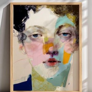 May include: Abstract portrait art print in a wooden frame. The artwork features a face with blue eyes, red lips, and colorful brushstrokes in pink, yellow, and blue. The subject has dark curly hair.