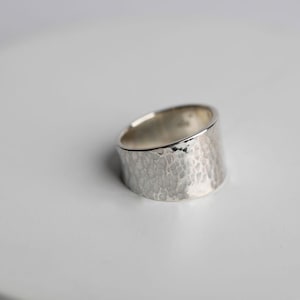 Sterling Silver Flared edge hammered band finish 8mm wide at top 6mm at bottom