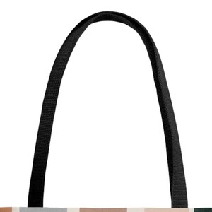 May include: Black tote bag with two long black straps. The bag is made of canvas and has a geometric pattern in shades of brown, beige, and gray.