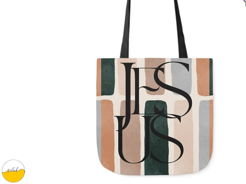 May include: A tote bag with a geometric pattern in shades of brown, green, and gray. The word "JESUS" is printed in black letters on the bag.