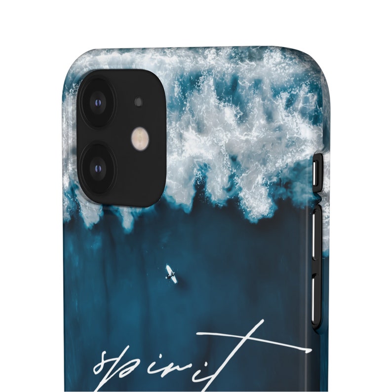 May include: A blue and white phone case with a photo of ocean waves and the word "spirit" written in white.