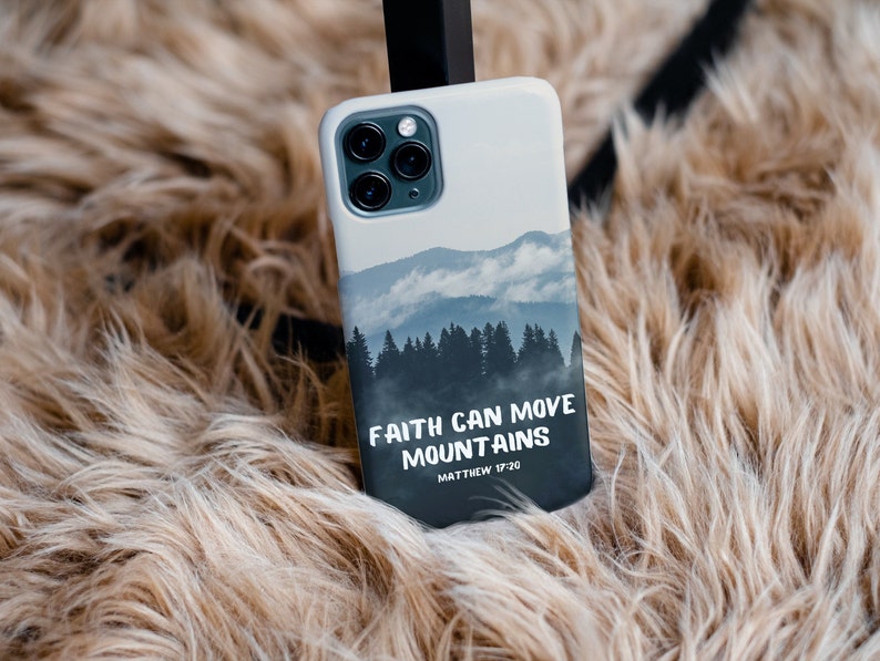 May include: A white phone case with a mountain scene and the text "Faith can move mountains Matthew 17:20".