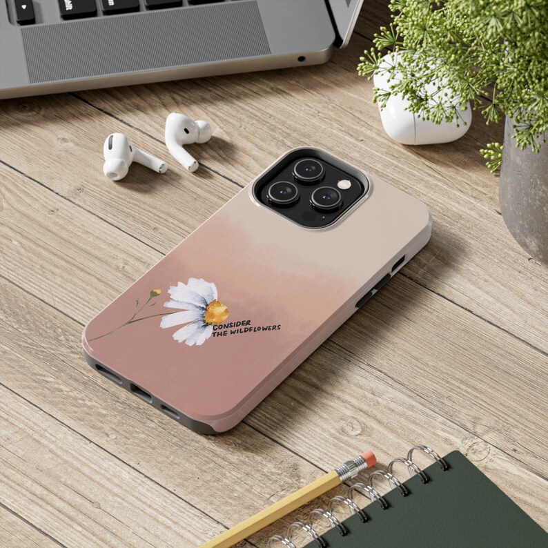May include: A pink and white phone case with a watercolor daisy and the text "Consider the wildflowers".